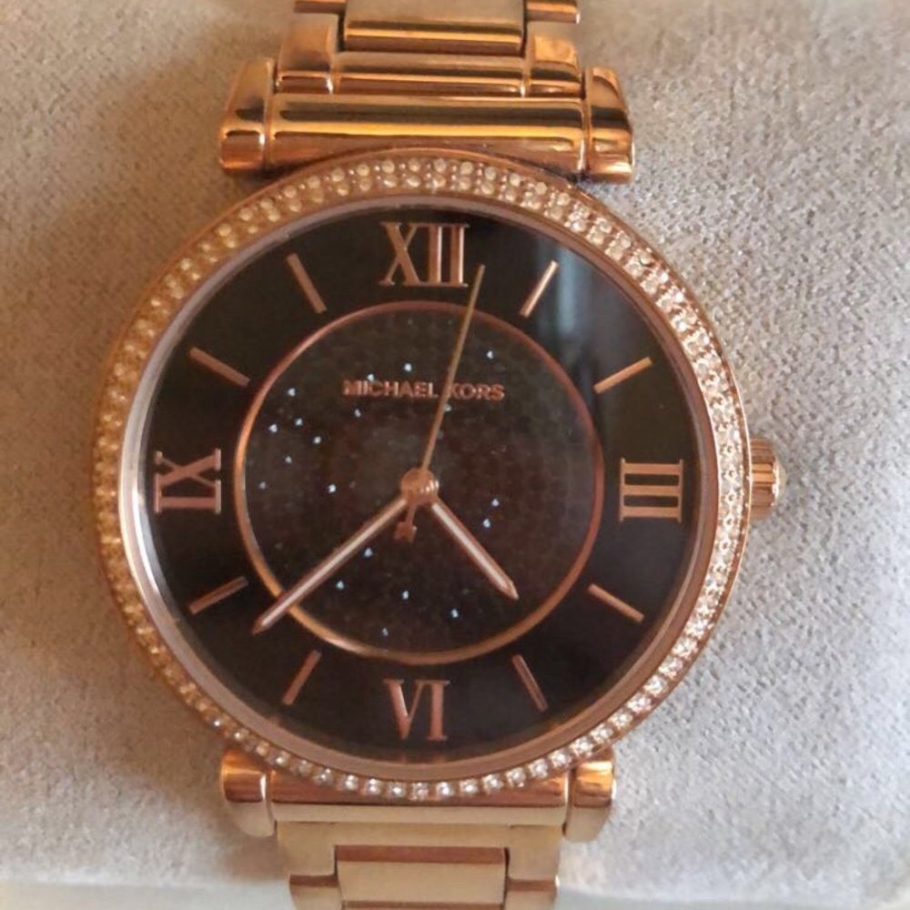 Woman’s Rose Gold Wrist Watch With Black Face